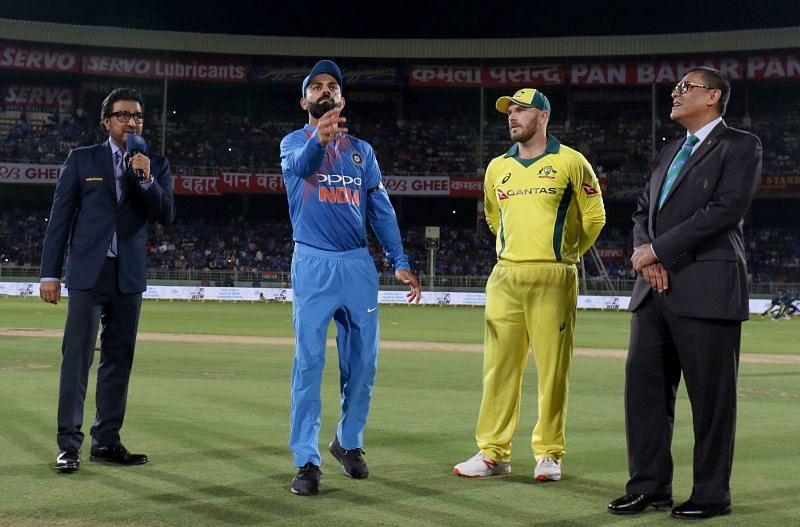 Two captions during toss