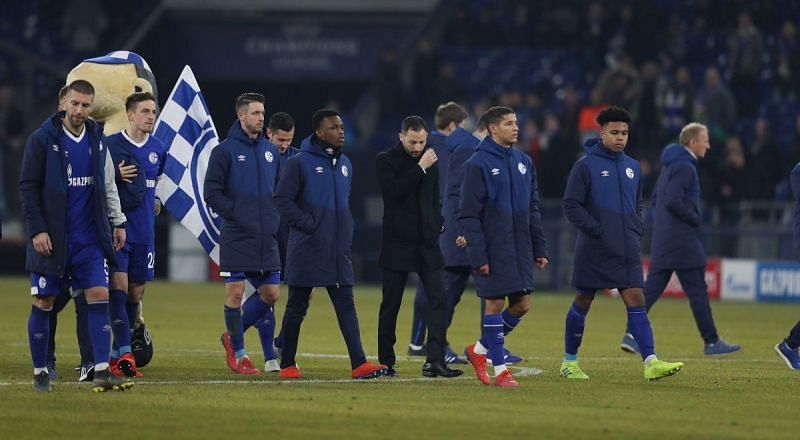 Schalke players trudge off, rightly disappointed after squandering a 2-1 lead against ten men!