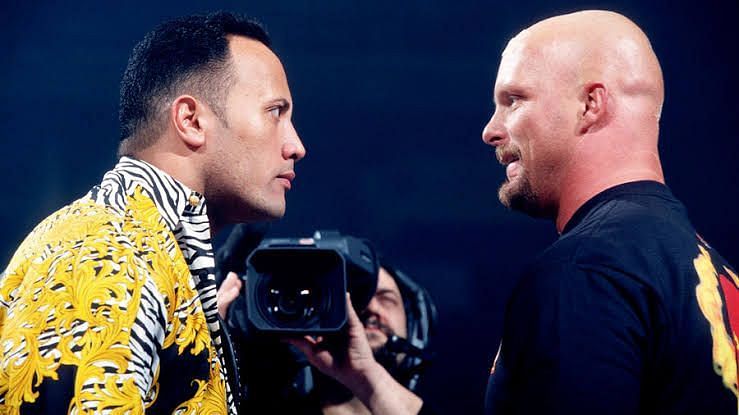 The Rock and Steve Austin having a staredown while promoting their match at WrestleMania