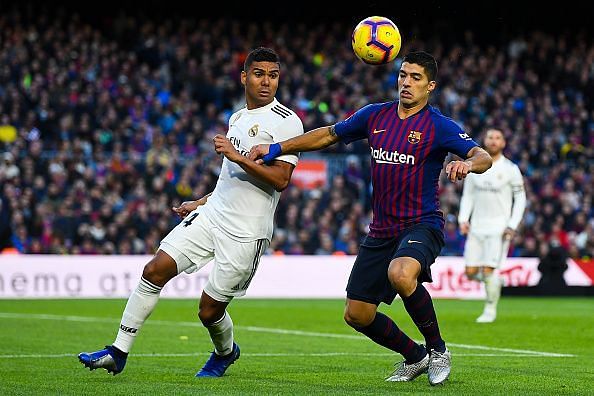Casemiro and Luis Suarez battle out for the ball