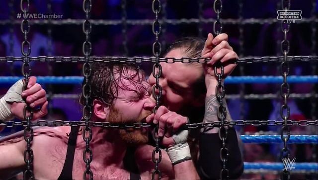 Baron Corbin punishes Dean Ambrose during the Elimination Chamber match, even though he was technically eliminated already by the Lunatic Fringe