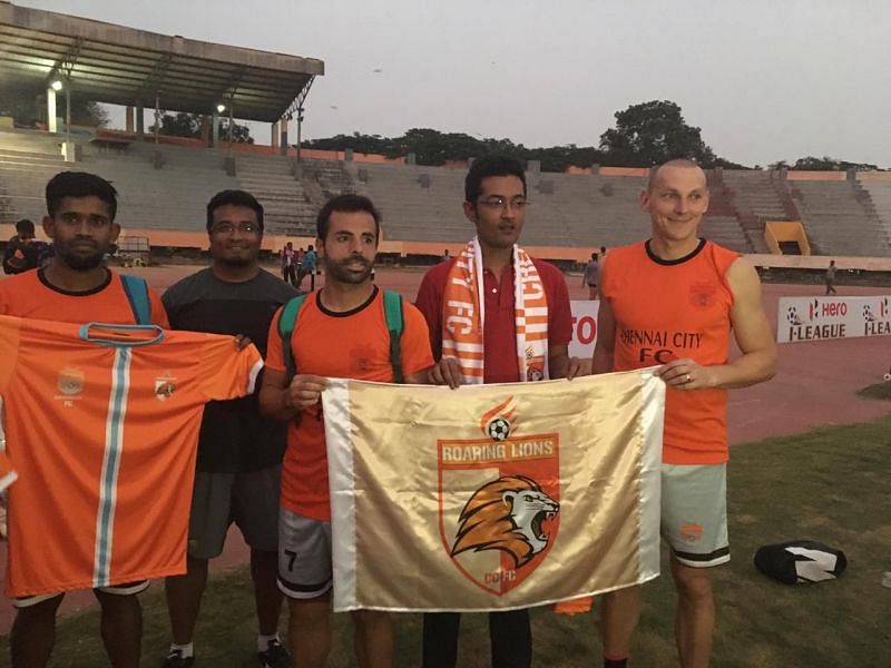 Roaring Lions Fan Club Chennai City FC owner Rohit Ramesh (centre) with the Roaring Lions banner