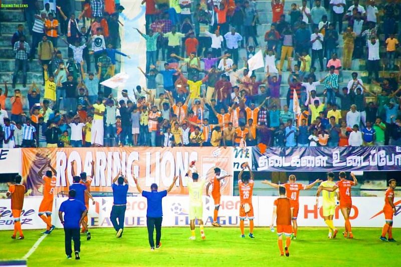 Members of the Roaring Lions Fan Club involved in a Viking Clap celebration with the Chennai City players after an I-League match