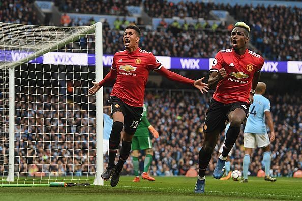 Chris Smalling and Paul Pogba celebrate as Manchester United take the lead