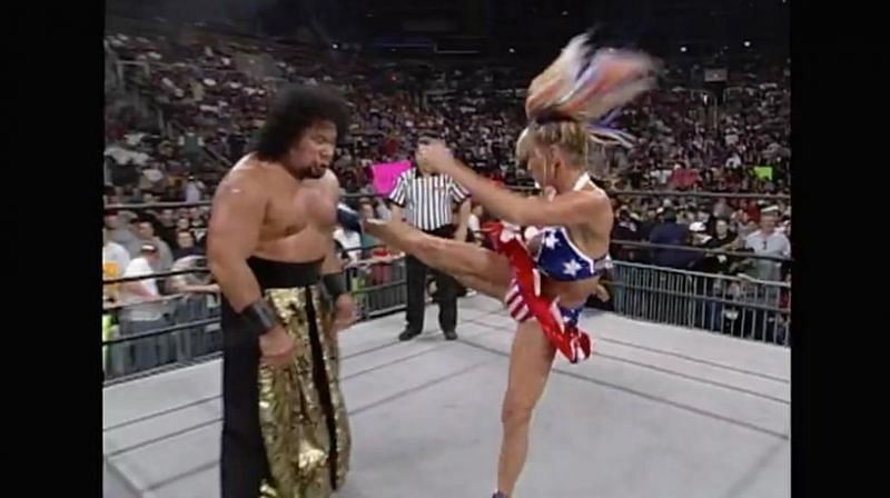 Madusa attempts to take down Meng with kicks. Attempts.