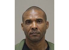 The Latest: MMA fighter wanted on murder charges captured