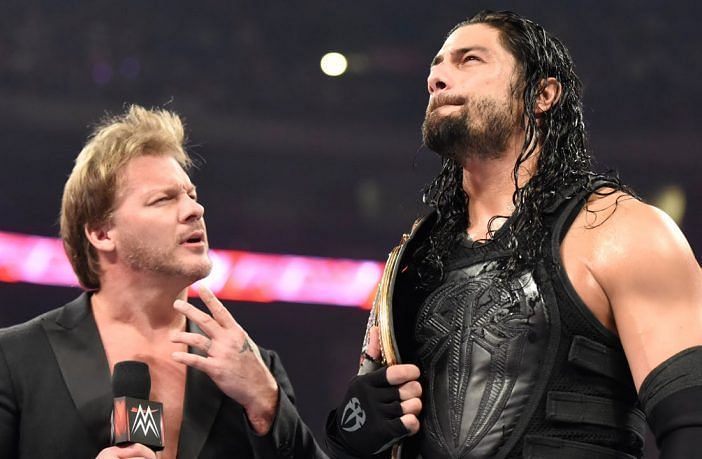 Chris Jericho (left) with Roman Reigns (right)