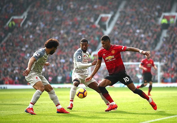 Rashford - who also picked up an injury in the first-half - pictured here, battling with Salah and Wijnaldum