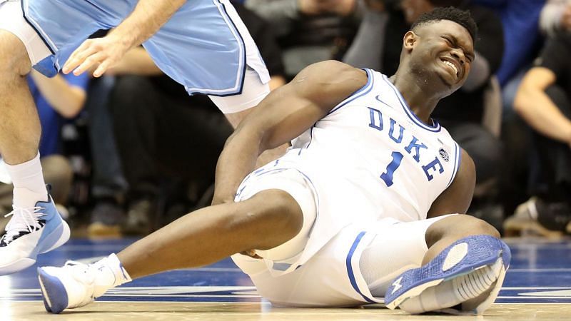 Zion Williamson suffers a knee injury in the first minute of the Duke/UNC game.