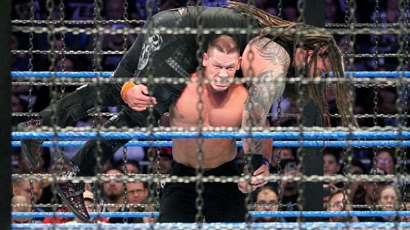 Cena hoists Bray Wyatt on his shoulders to deliver the AA.