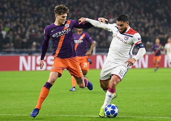 Fekir holds off John Stones in the Champions League victory over City