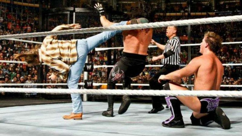 Yes, that's the Heart Break Kid Shawn Michaels in his street clothes devastating The Undertaker with his patented Sweet Chin Music finishing move