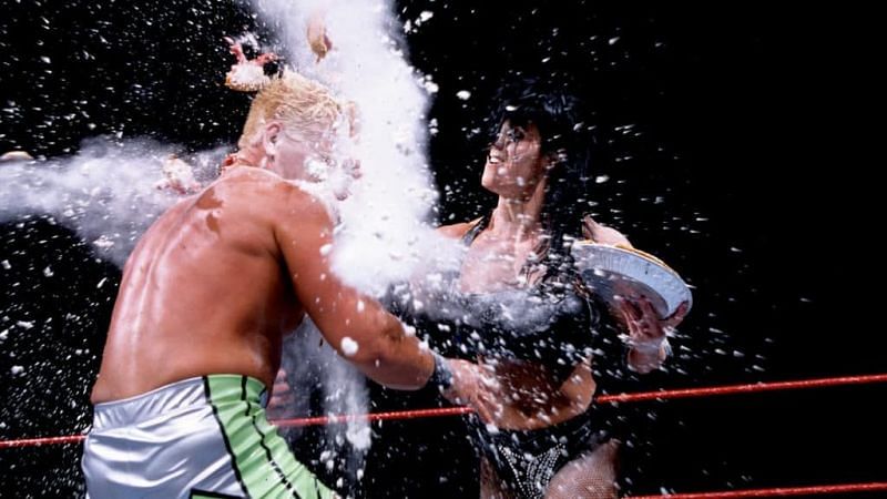 Chyna devastates Jeff Jarrett with a bag of flour.