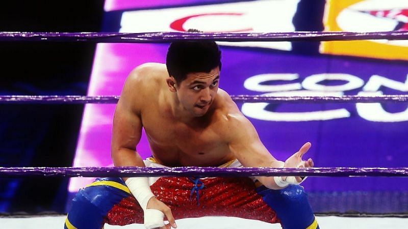 TJ Perkins beckons his foe to return to the ring.