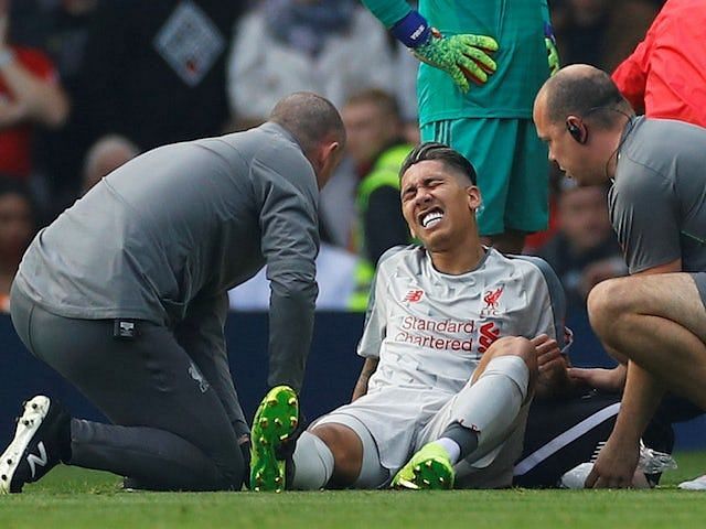 Roberto Firmino was stretchered out during the game against Manchester United