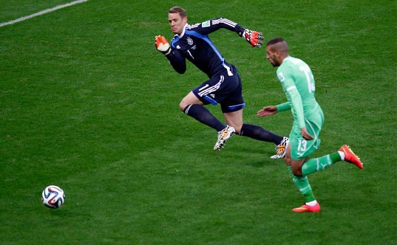  Manuel Neuer ready to tackle an Algerian player in the Round of 16 of the FIFA World Cup, 2014. 