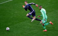 Manuel Neuer ready to tackle an Algerian player in the Round of 16 of the FIFA World Cup, 2014.