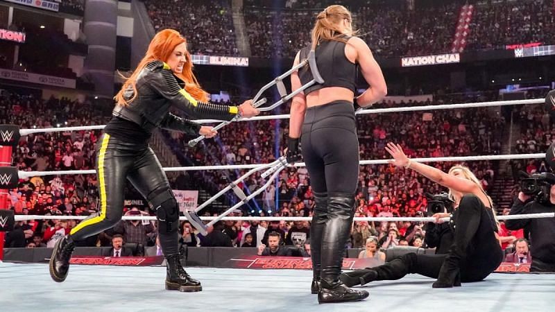 Becky Lynch attacked Charlotte Flair and Ronda Rousey at Elimination Chamber