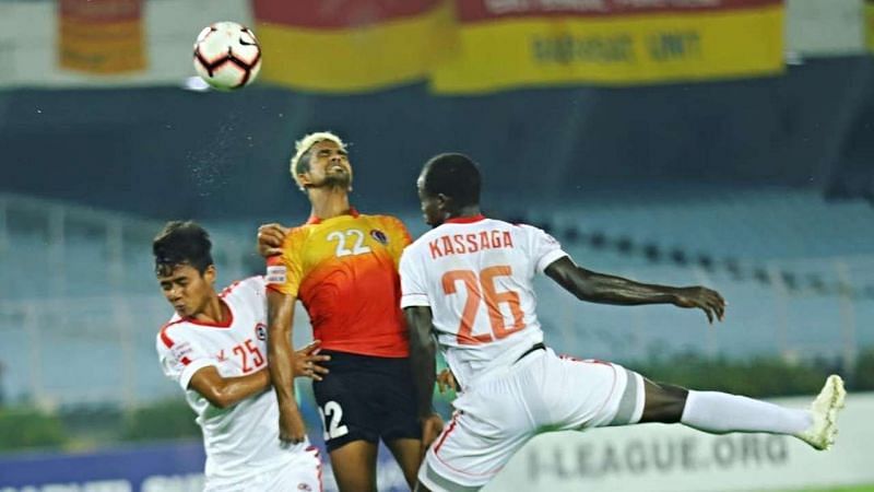 Jobby Justin in action along with two Aizawl players on Monday evening