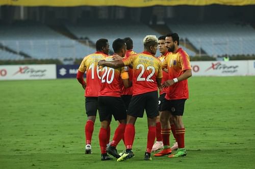 East Bengal players celebrate after scoring a goal