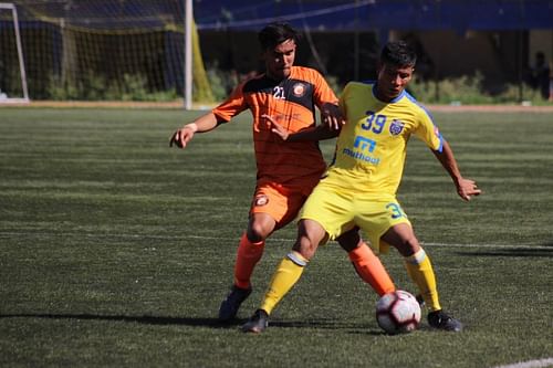 Kishan of South United FC battles for the ball