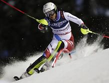 The Latest: Holdener retains Alpine combined title