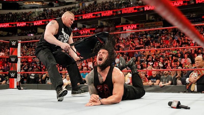 Lesnar pummeling Reigns with a steel chair