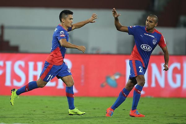 Sunil Chhetri celebrates after scoring the equaliser against Kerala Blasters with Rahul Bheke