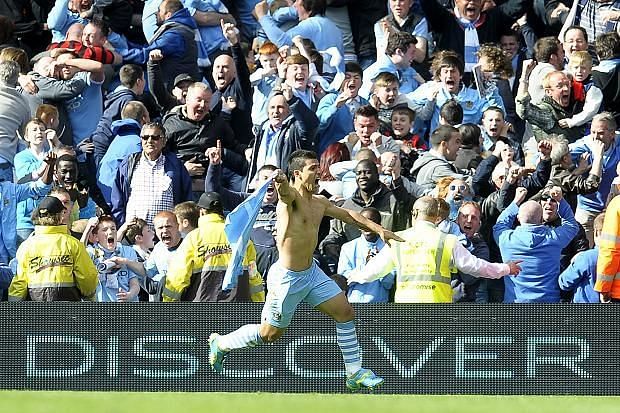 One of the most iconic photos ever, Sergio Aguero reels away in celebration as he wins Manchester City the league