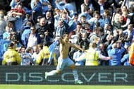 One of the most iconic photos ever, Sergio Aguero reels away in celebration as he wins Manchester City the league