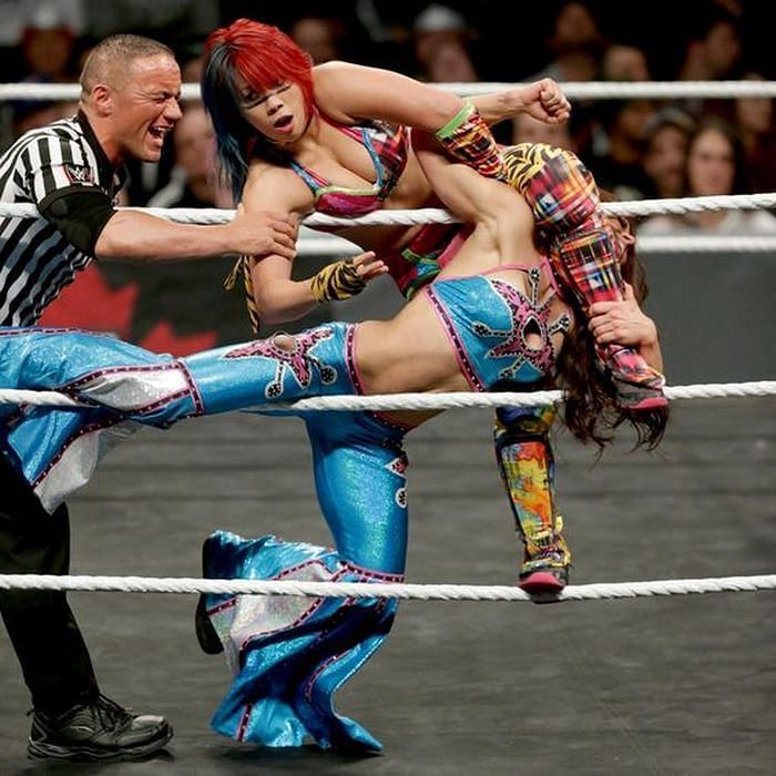 Asuka holds Mickie James in an octopus stretch