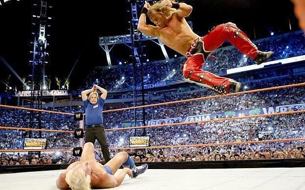 HBK in mid-air, looking for an elbow drop on Flair!