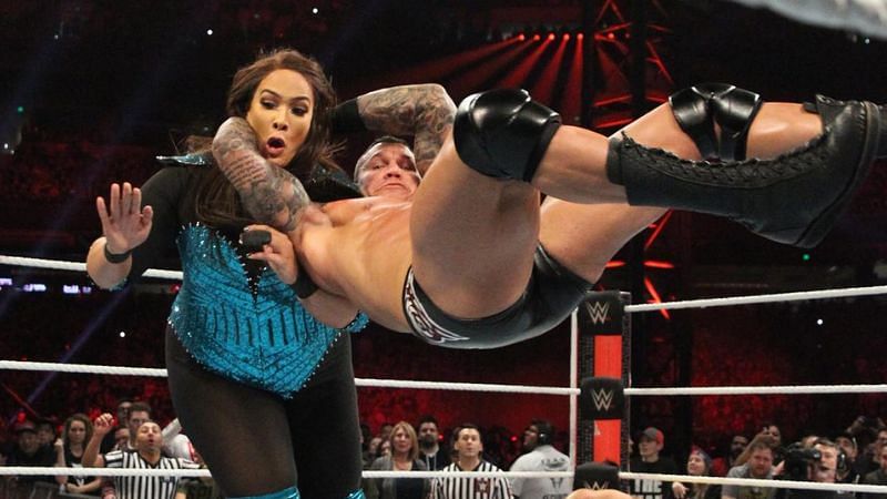 Randy Orton&#039;s face is all business as he drives Nia Jax to the mat with an RKO during the Men&#039;s Rumble