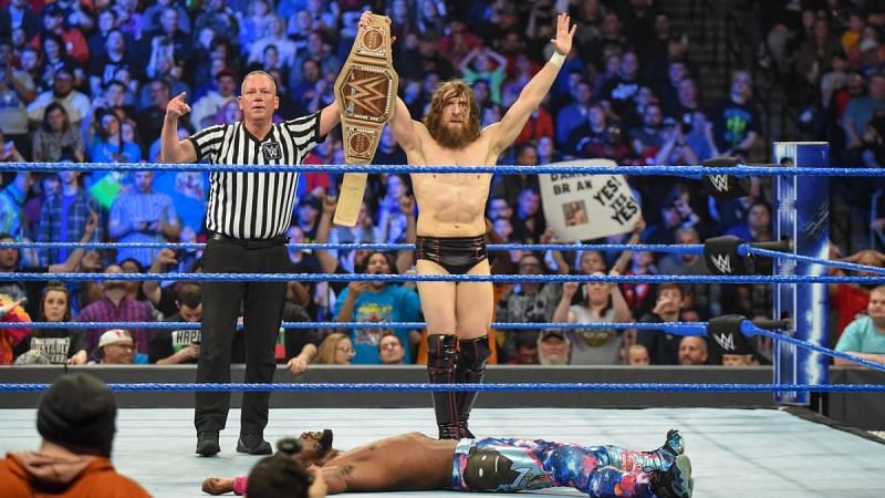 Bryan celebrates his victory, which means Kingston will not challenge him at WrestleMania.