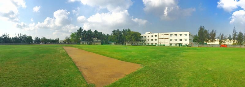 The state-of-the-art cricket ground has a lush green grass outfield