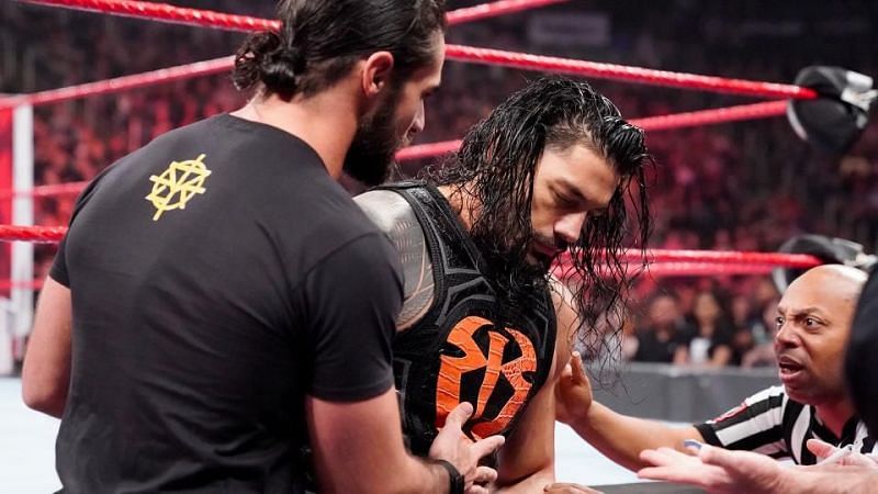 Seth Rollins helping Roman Reigns to the back on RAW