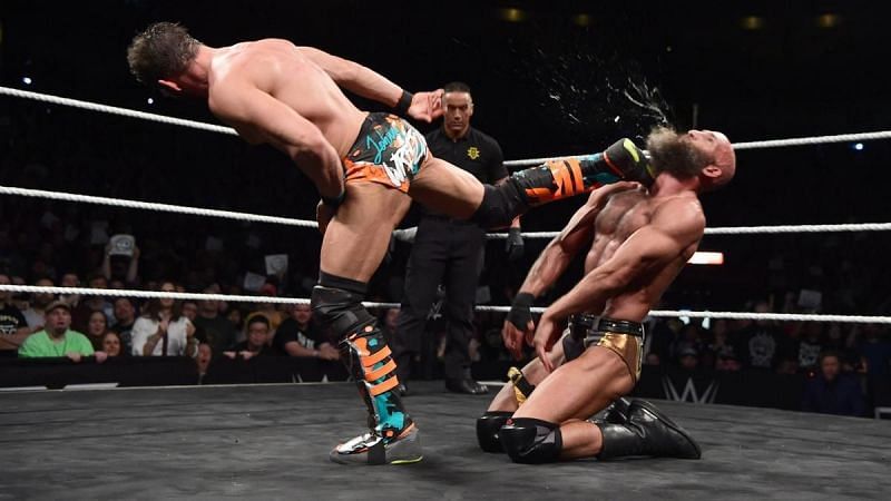 Johnny Gargano kicks the taste out of Tommaso Ciampa&#039;s mouth during their heated rivalry.