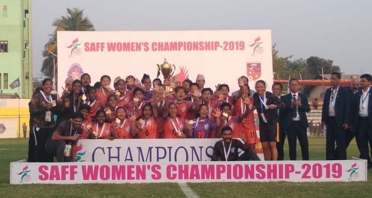 The Indian women&#039;s football team celebrates its SAFF Cup win over Nepal