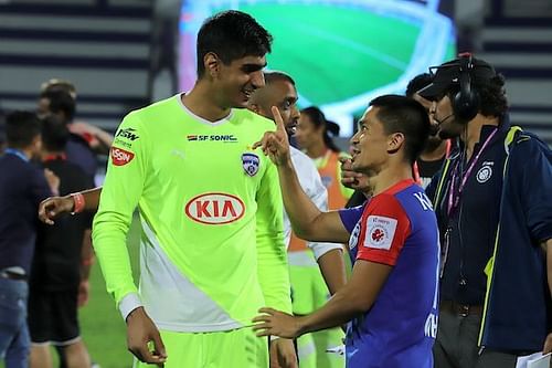 Gurpreet Singh Sandhu (left) of Bengaluru FC, always sporting a flashy jersey, with captain Sunil Chhetri