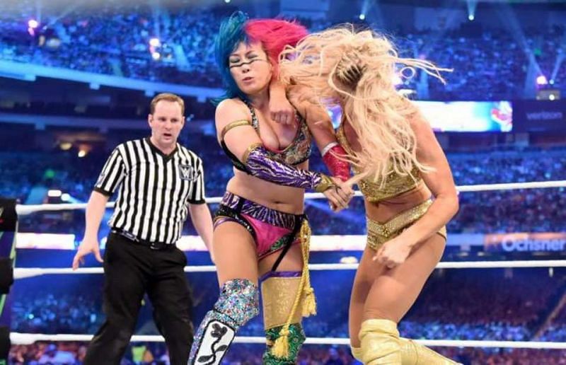 Charlotte catches Asuka with a stiff elbow shot during their Wrestlemania 34 encounter