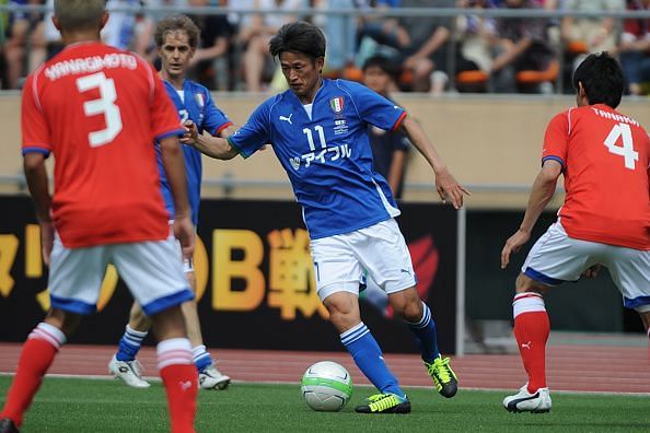 Kazuyoshi Miura dribbles the ball