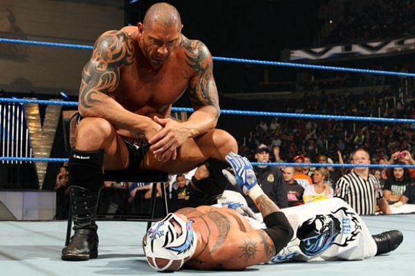 Batista looking at a dazed Mysterio