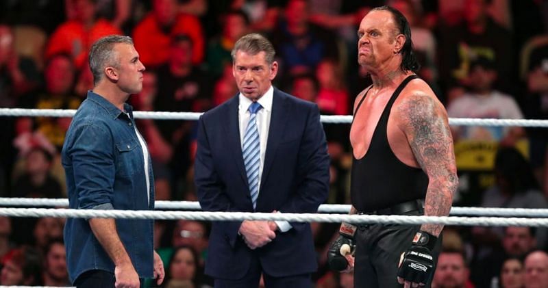 The Undertaker with WWE chairman Vince McMahon and his son Shane