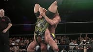 Rob Van Dam in the clutches of Jerry Lynn's cradle piledriver finisher.
