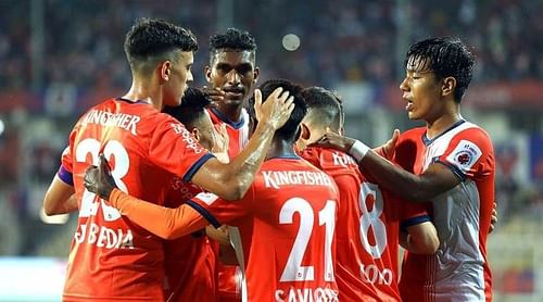 Players celebrating after a goal