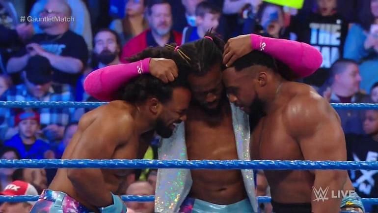 Kofi Kingston hugs his brothers after the won the gauntlet match to send him to WrestleMania.