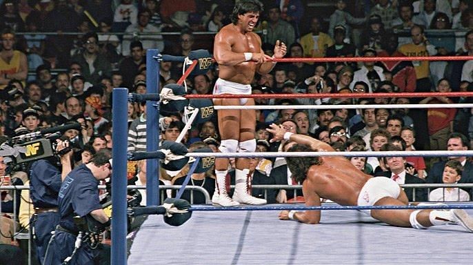 Rick Martel stands on the apron after Santana hit him with a forearm, leading to the break up of Strike Force