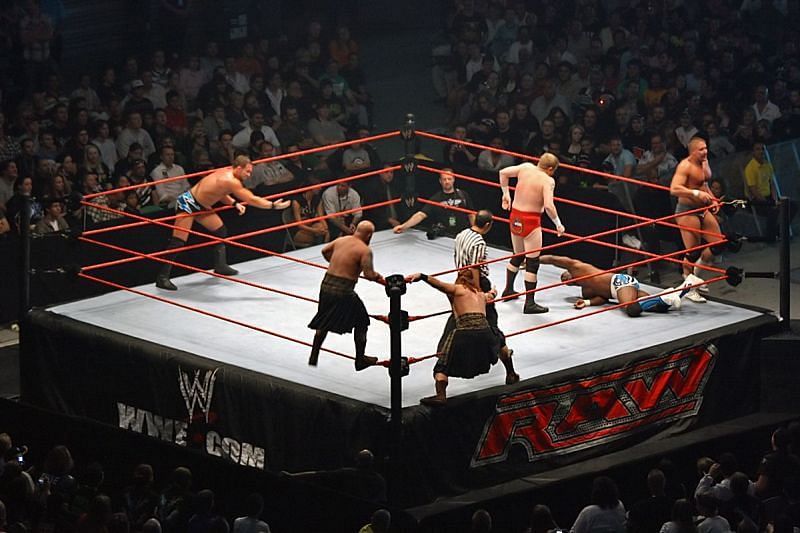 The Highlanders ( center ) at a live event against Cade &amp; Murdoch and the World&#039;s Greatest Tag Team.