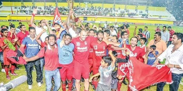 Churchill Brothers&#039; players celebrate with fans after winning the 2012-13 I-League