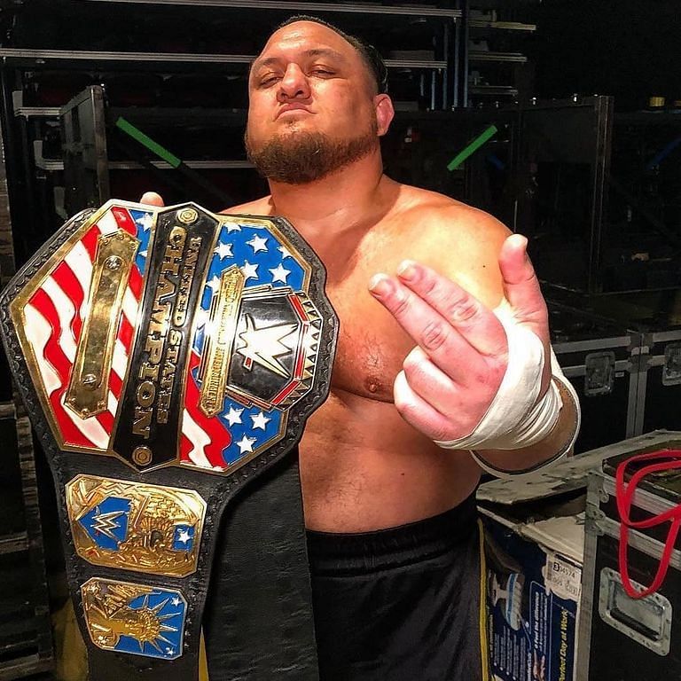 Samoa Joe proudly displays his United States Championship.